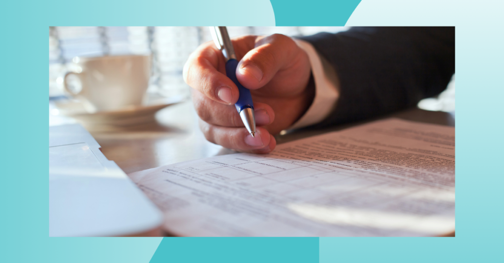 Close-up of a business professional signing financial documents, representing payment compliance, audit readiness, regulatory documentation, risk management, and secure financial operations.